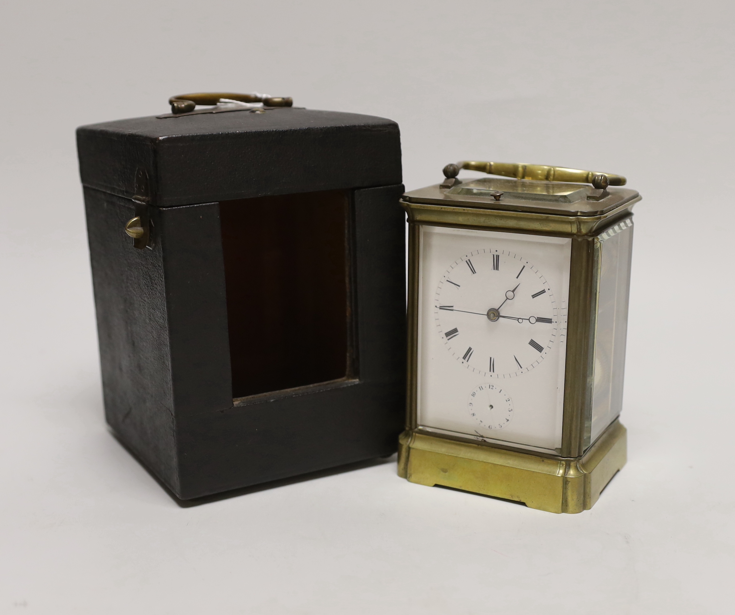 A repeating carriage clock with alarm dial striking on a bell, engraved to movement ‘Aiguilles Aig Reveil’ and stamped ‘Japy Freres, Exposition 1855 Grande Med D’Honneur’, with case, 13.5cm high